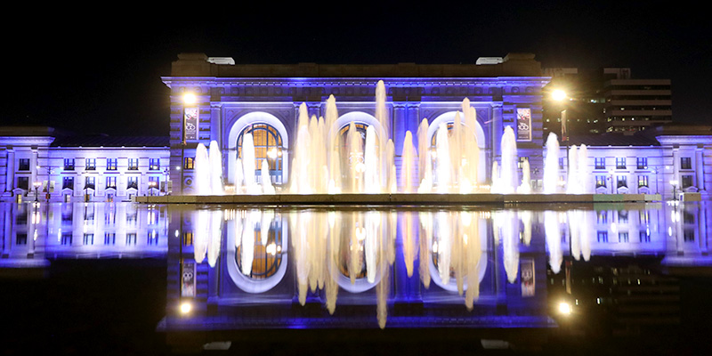 Henry Wollman Bloch Fountain in front of Union Station shining in blue