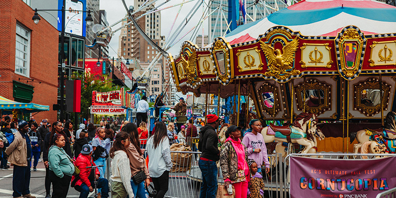 Families waiting in line for a carousel