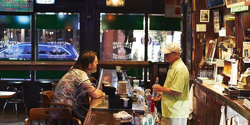 Customer sitting at bar in Kelly's