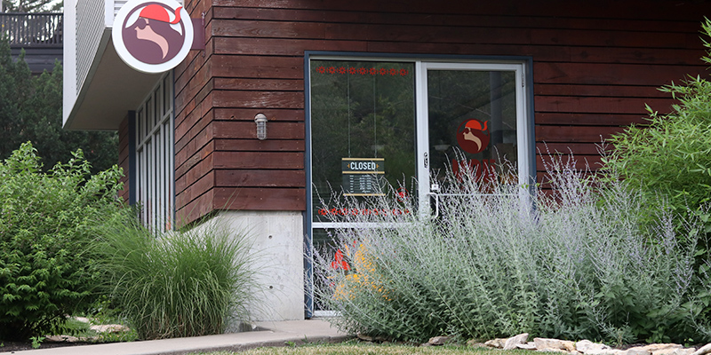 Exterior photo of Yoli Tortilleria surrounded by green grass and trees