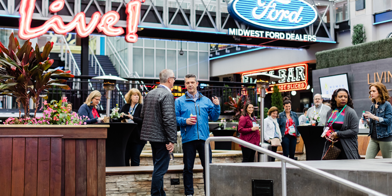 Professionals gathered in the outdoor area of Kansas City Power and Light District, an entertainment hub